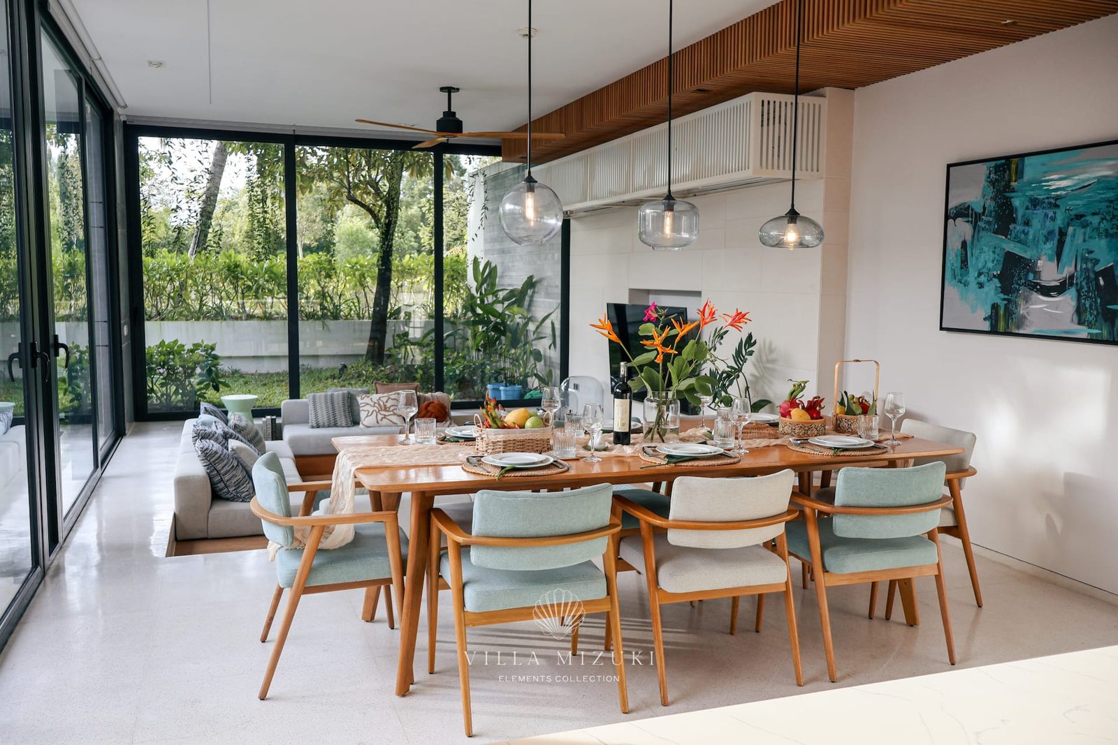 Spacious and bright dining area surrounded by glass walls, perfect for family meals and long conversations.